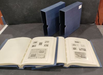 two open books sitting on a table next to each other