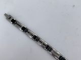 a close up of a pen on a table with a white background