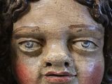 a close up of a statue of an angel on a table