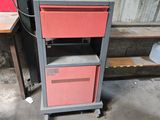 an image of a metal cabinet with two red drawers