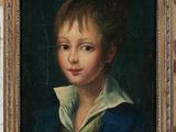 portrait of a young boy in a blue jacket and white collared shirt