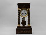 a wooden clock that is sitting on a table