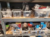 many bins of assorted items on a shelf