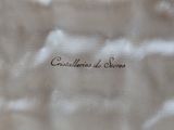 a close up of a white bag with writing on it