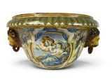 a large bowl with a painting on it on a white surface