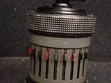 a small metal object with a number on it