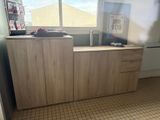 a picture of a kitchen with a refrigerator and a window