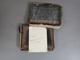 a piece of paper in a box with a piece of writing on it