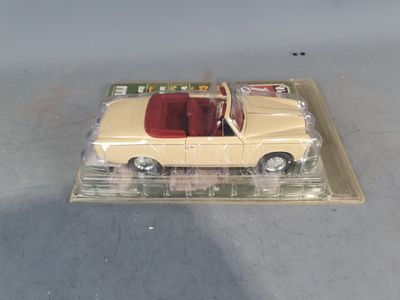 a toy car that is sitting on top of a box