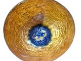 a glass bowl with a blue and yellow design on it