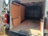 a white van with a wooden floor in the back of it