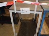 a red and white barricade on a table in a room