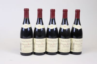 six bottles of red wine are lined up in a row