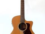a close up of a guitar on a stand against a white background