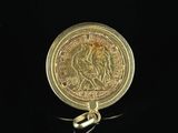 an image of a gold coin with a bird on it