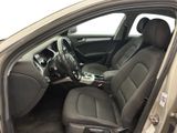 the interior of a car with the door open and the driver ' s seat down