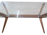 glass coffee table with wooden legs and a clear glass top
