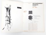 an open book with a drawing of a tower on it