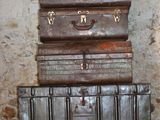three suitcases stacked on top of each other on a table