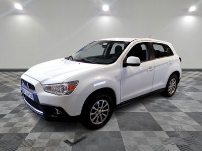 a picture of a white suv parked on a checkered floor