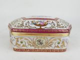 an image of a white and gold box with flowers on it