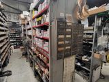 many shelves of food in a store with many items on them
