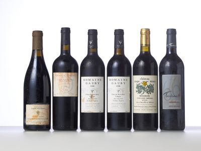 several bottles of wine are lined up on a table