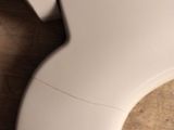 a close up of a toilet seat with the lid up