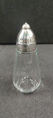 an image of a glass salt shaker with a silver lid