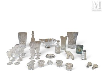 a lot of silver and glass items on a white surface