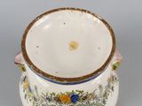 an image of a white and blue vase with flowers on it