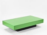 a green coffee table sitting on top of a white surface