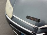 a close up of a car with a sticker on it ' s hood