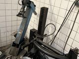 a pile of tools sitting on the floor in a garage