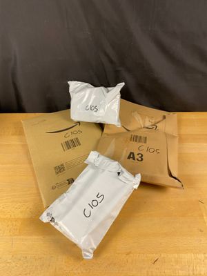 three bags of food sitting on top of a wooden table