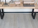 a wooden table with a bunch of books on it