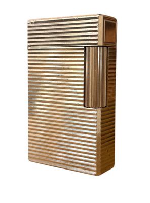 an image of a metal lighter with a wooden cover