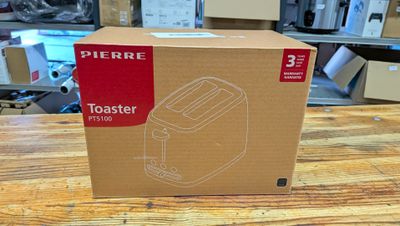 une boîte contenant un grille-pain, posée sur une table
