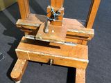 a small wooden easer with a wooden seat on it
