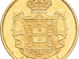 a close up of a gold coin with a crown on it