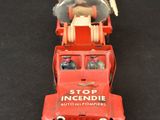 a toy truck that is sitting on a black surface