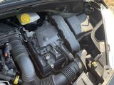 a car engine that is sitting in the trunk of a car