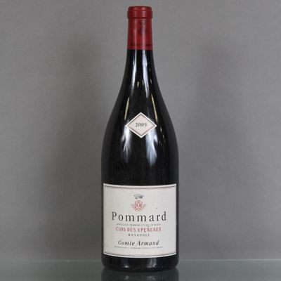a bottle of red wine sitting on top of a glass table