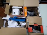 a box of electronics that is sitting on the floor