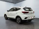 the rear view of a white suv parked in a garage