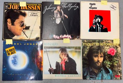 a lot of vinyl records that are on the table