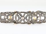 an antique diamond bracelet with filigrees and filigrees on a white background