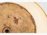 a close up of a plate with a clock on it