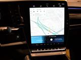 a car dashboard with a map on the screen