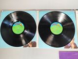 two black vinyl records sitting on top of each other